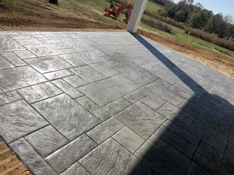 Stamped concrete in a rectangular ashlar slate pattern.