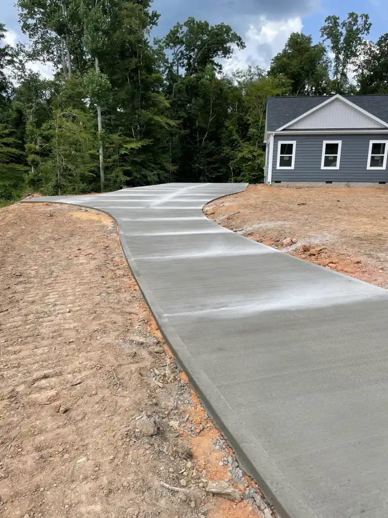 A finished concrete driveway at a residential property.
