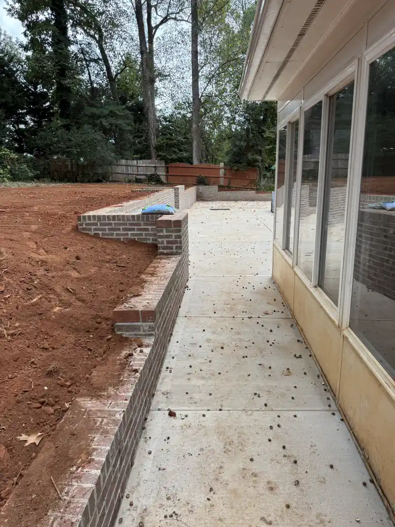 A concrete sidewalk running alongside a roadway.